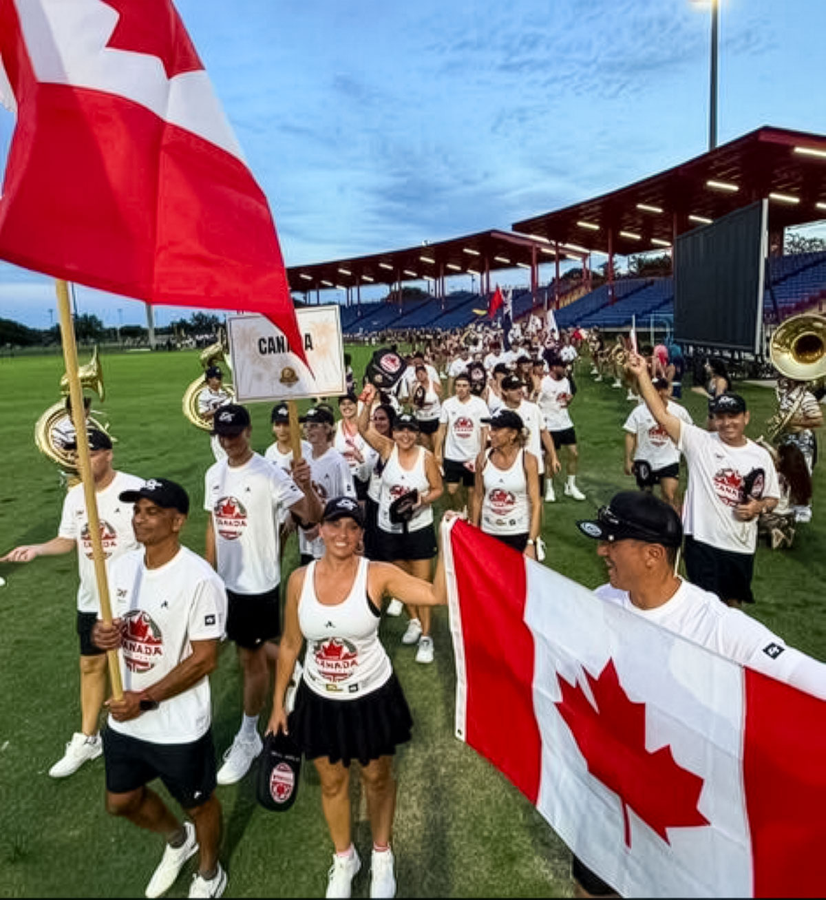 Flag bearer and Senior Team Member Robin D’Abreo—member of Team BC who captured Gold at the 2025 Canadian Nationals’ inaugural Inter-Provincial Competition, and Pickleball BC Executive—leads the Canadian contingent at the opening ceremonies . ​